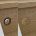 Turned wooden mushroom button plug used as furniture screw cover