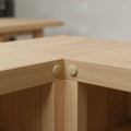 Turned wooden mushroom button plug used to cover screws in furniture