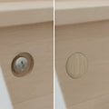 Turned wooden mushroom button plug installed as decorative screw cover in furniture