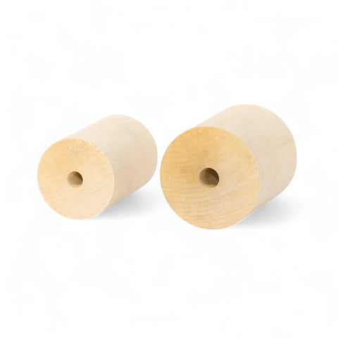 wooden cylinders in 40 × 60 mm and 50 × 60 mm sizes stacked together
