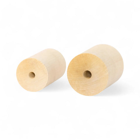 wooden cylinders in 40 × 60 mm and 50 × 60 mm sizes stacked together