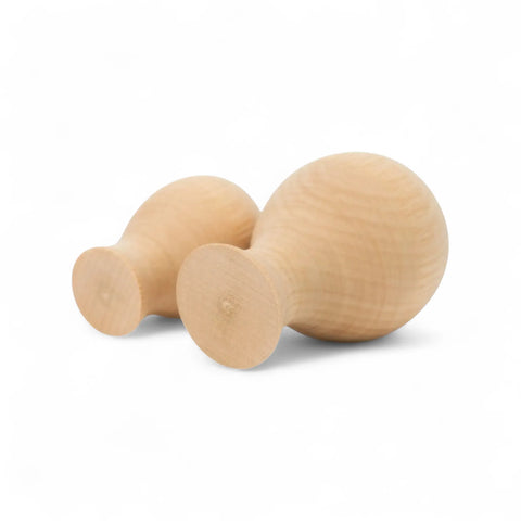 30 mm ja 40 mm suur treitud puidust vase kujundid side by side