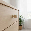 33 mm round oak wooden cabinet knob installed on cabinet door