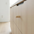 Close-up of 25 mm turned wooden peg cabinet knob showing wood grain