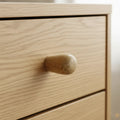 11 mm mini oak puidust mööblinupp installed on cabinet door